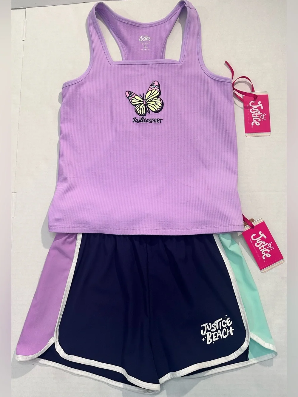 Justice Girls Lilac Butterfly Tank Top and a Pair of Justice Beach Board Shorts